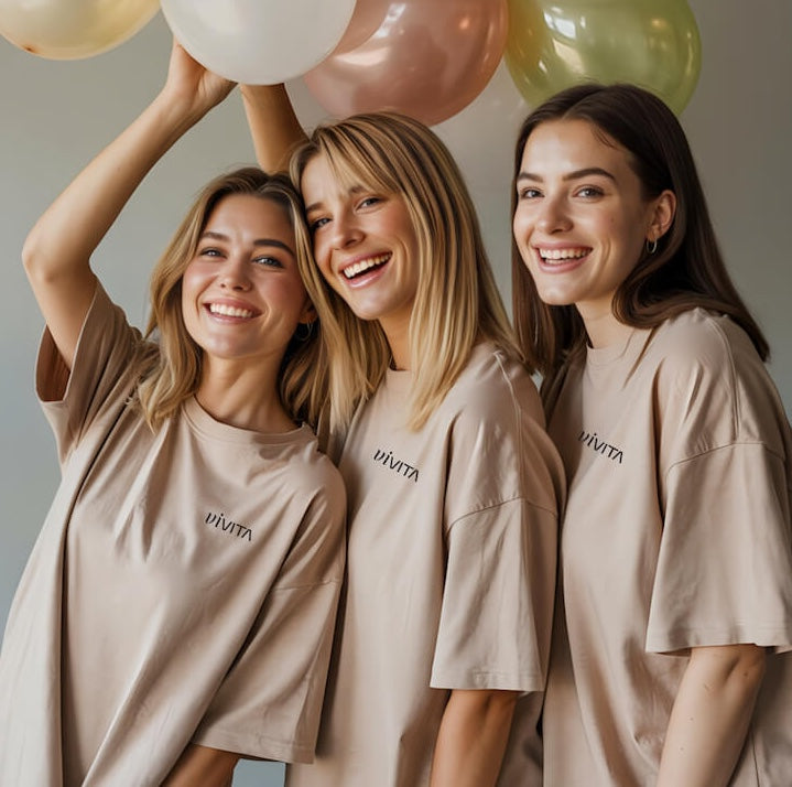 Vivita models holding balloons.