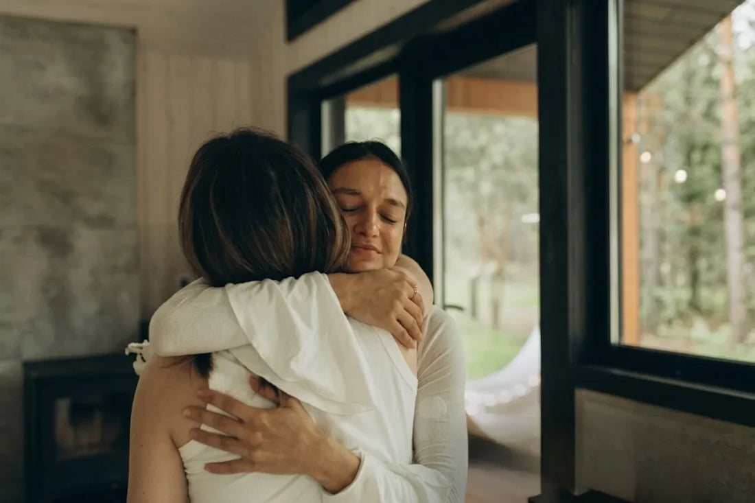 Two woman hugging