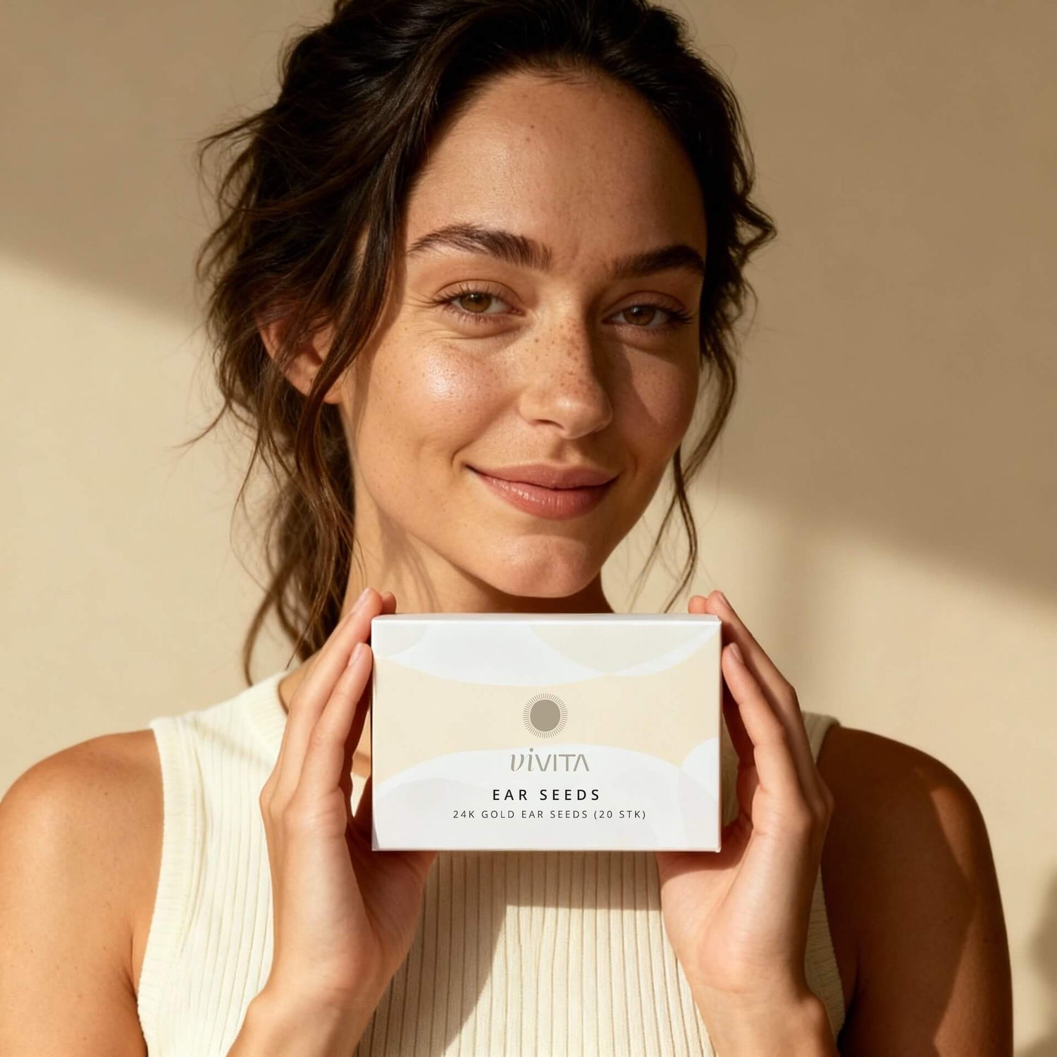 Woman holding Vivita Ear Seeds box