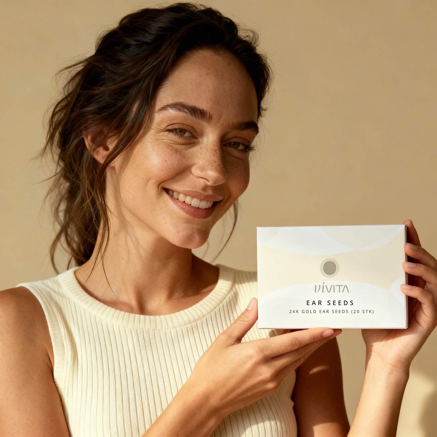 Woman holding Vivita Ear Seeds box