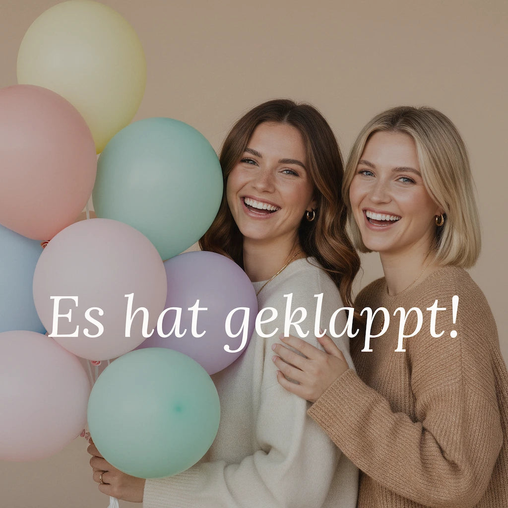 Two woman holding colorful balloons in a studio setting