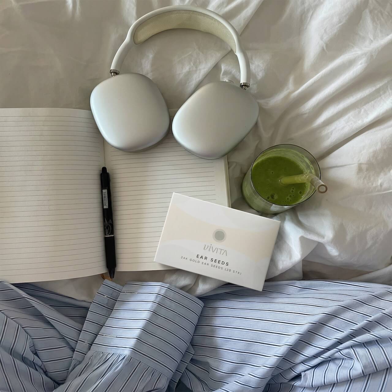 POV slow morning picture with journal, matcha and ear seeds